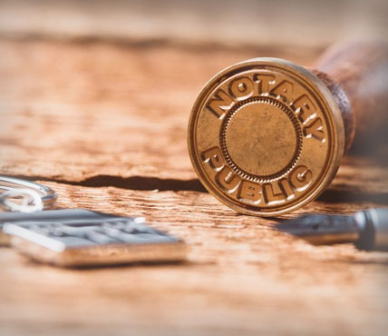 A close up of a bullet casing on top of a table.